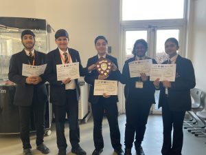 Five pupils of Carlton Bolling Academy with their individual certificates and victory shield